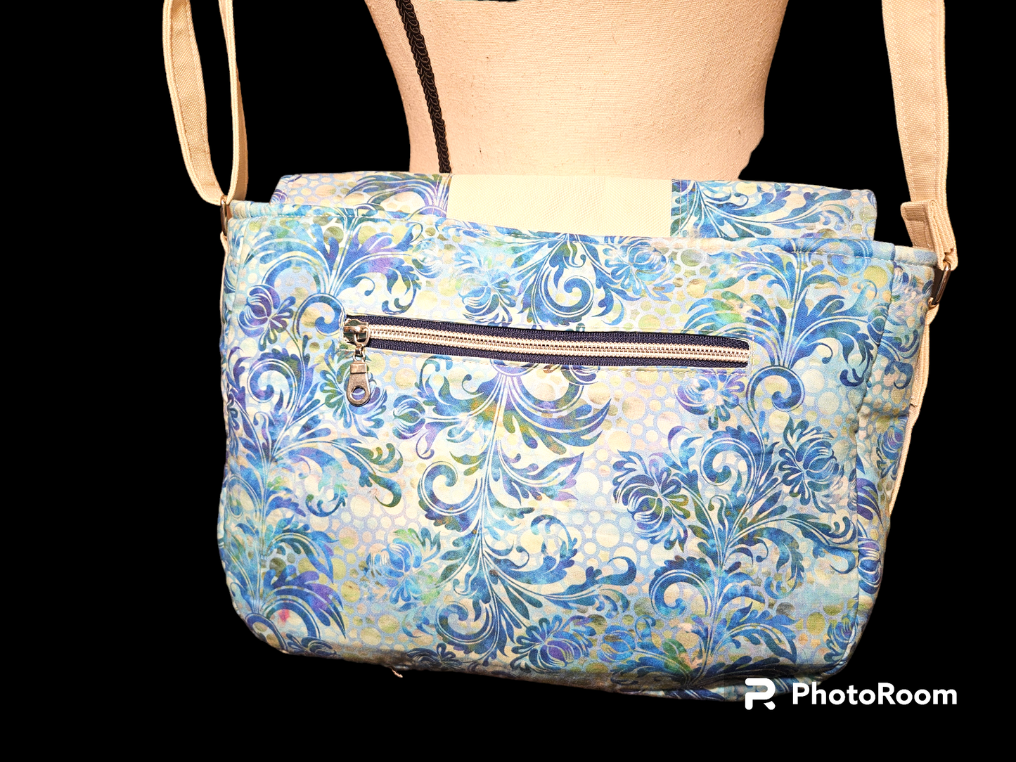 Blue floral messenger bag with divider pocket
