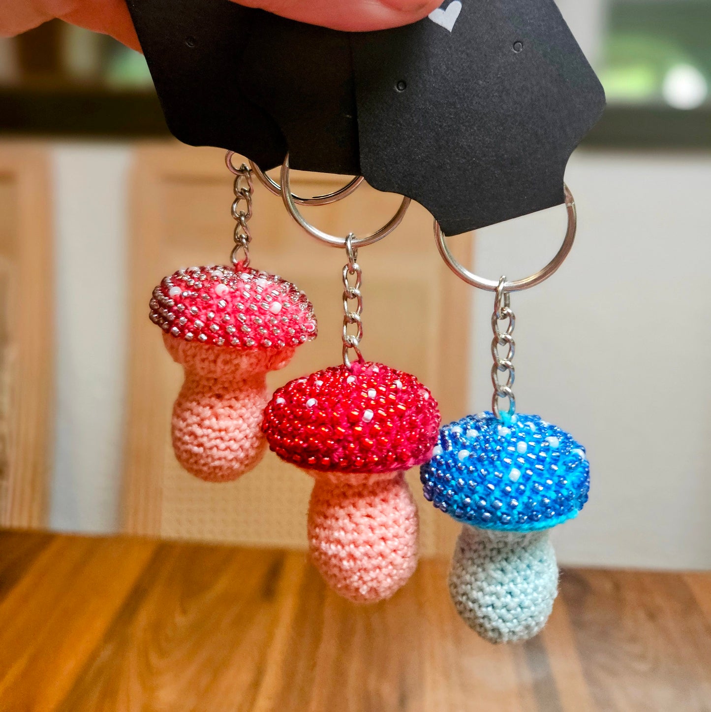 Bead-crocheted mushroom keychains