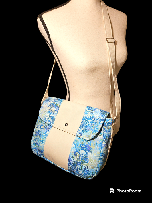 Blue floral messenger bag with divider pocket